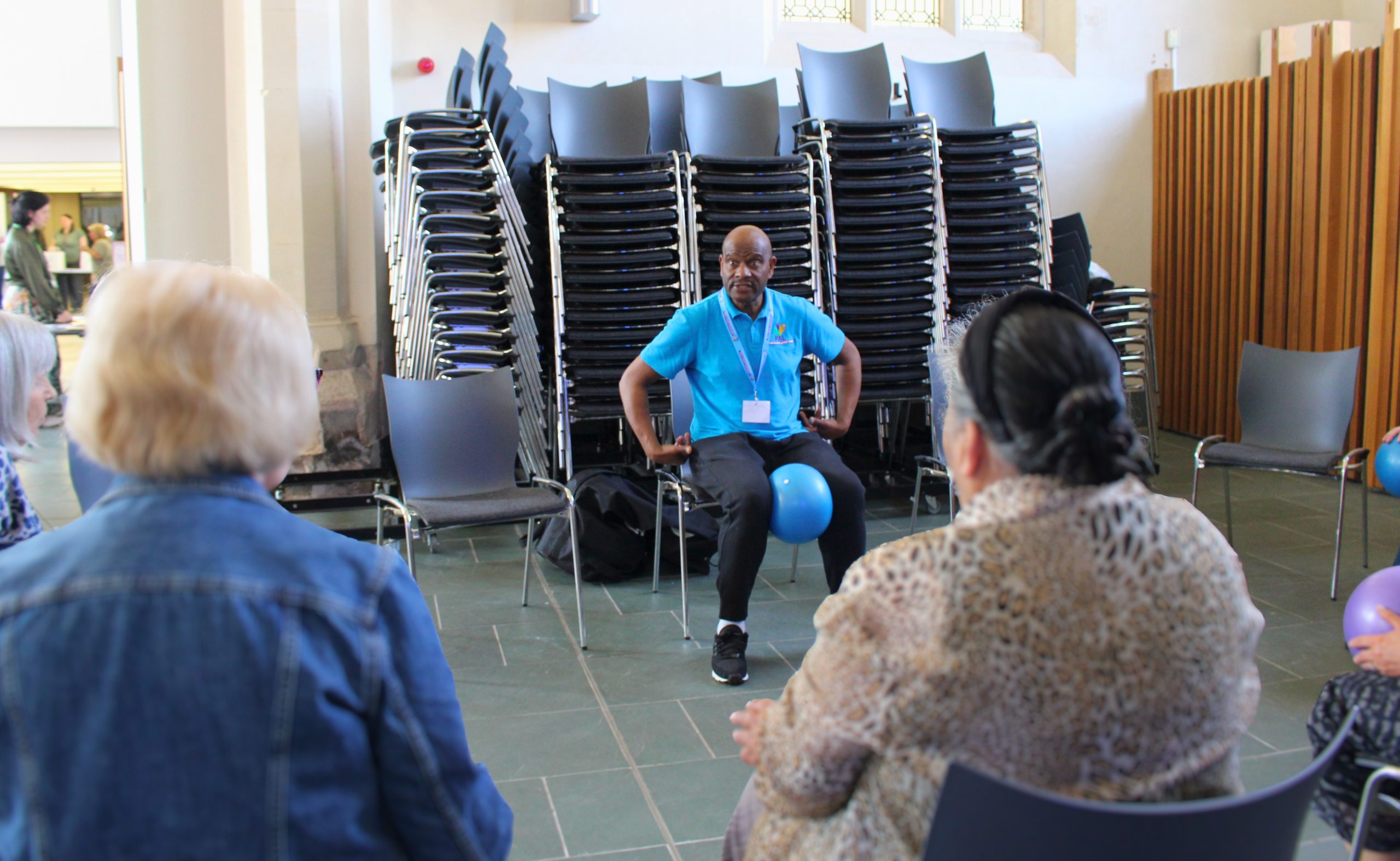 PAL conducting a seated exercise at St Barnabas Church