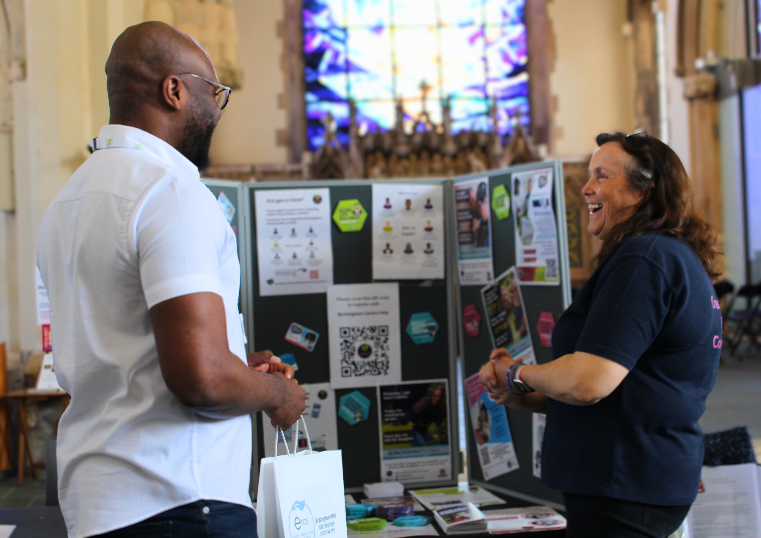 Stall holders at the Lets Get Together event in discussion.