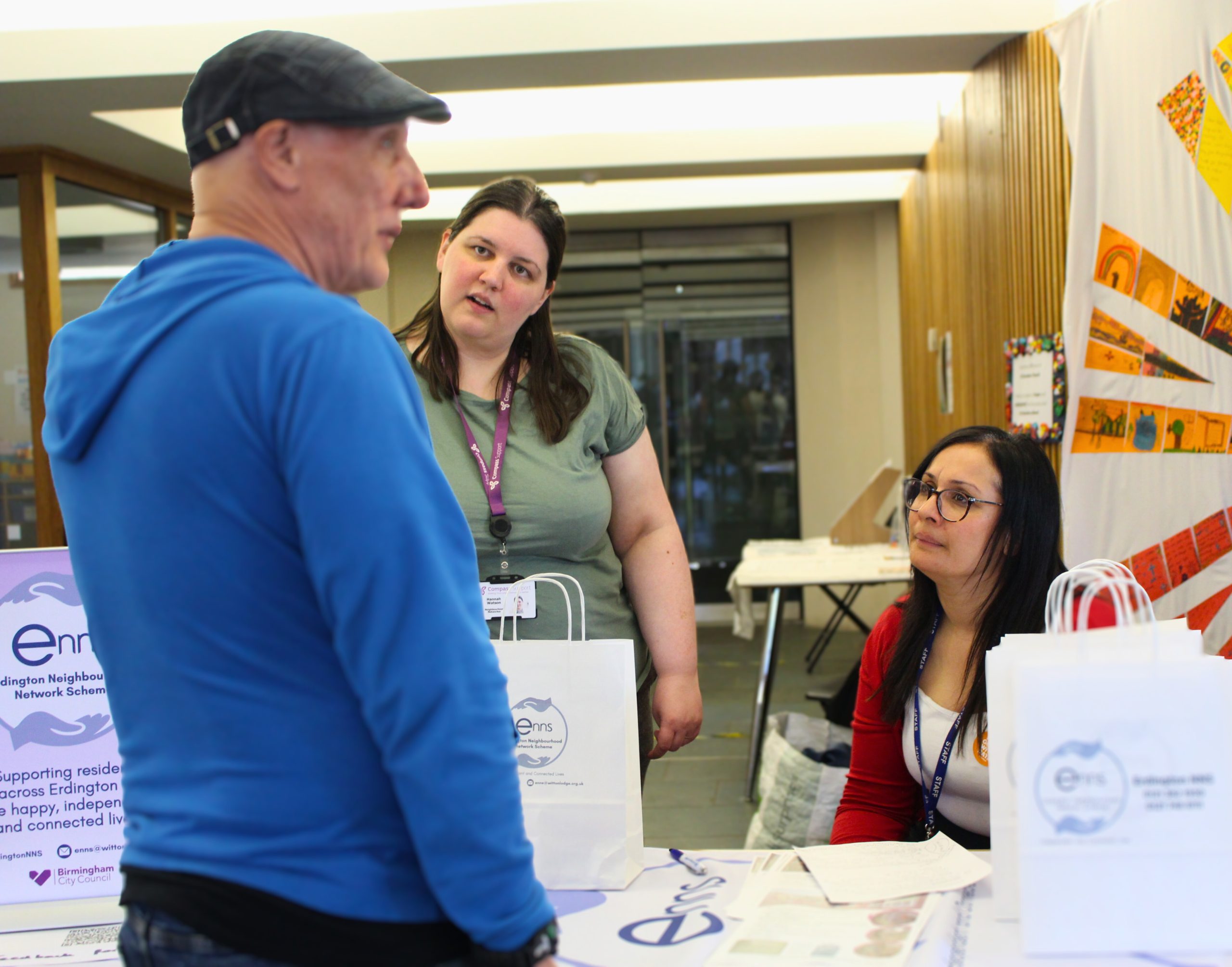 The ENNS team in discussion with a member of the public.