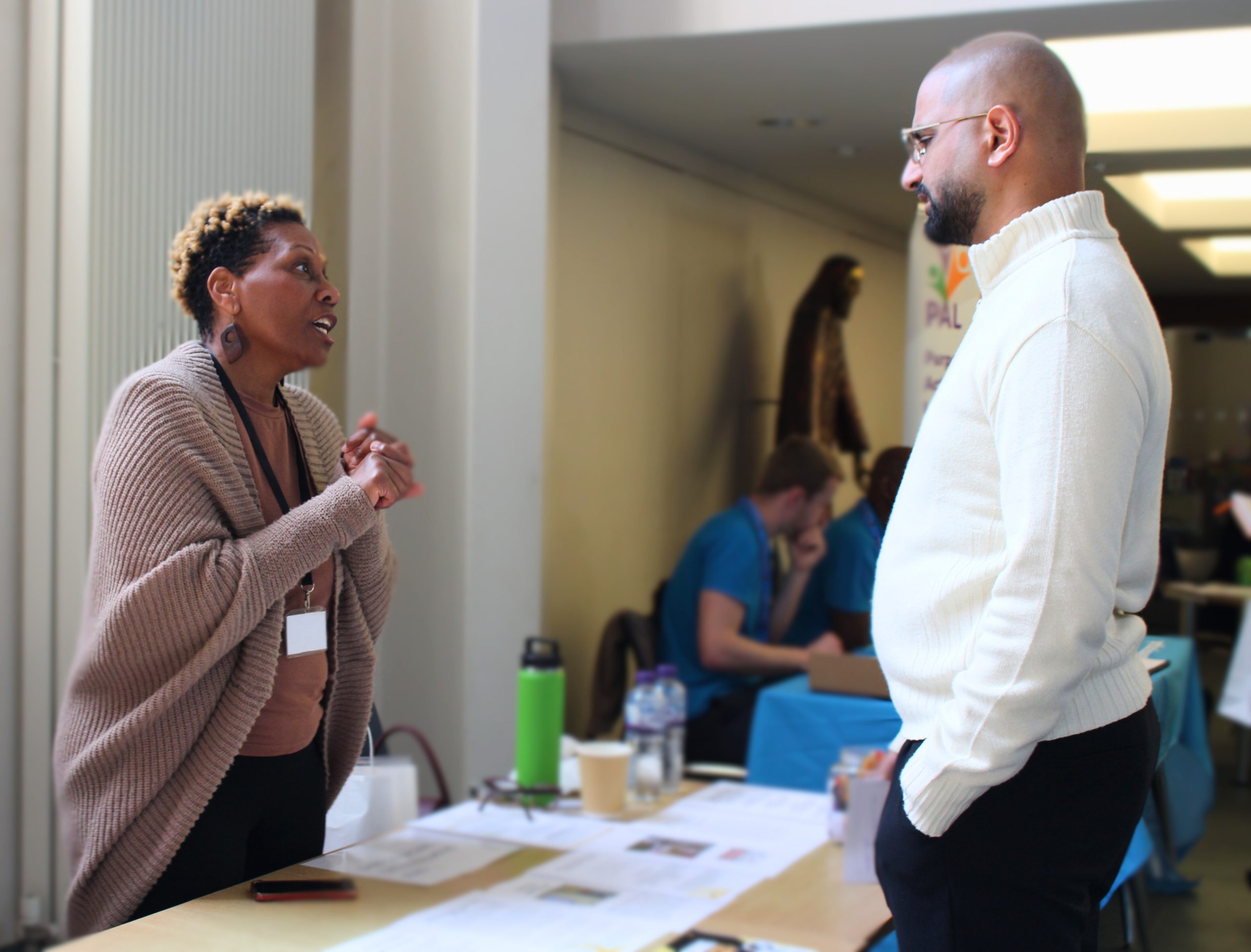 Stallholders in discussion at the Lets Get Together event.
