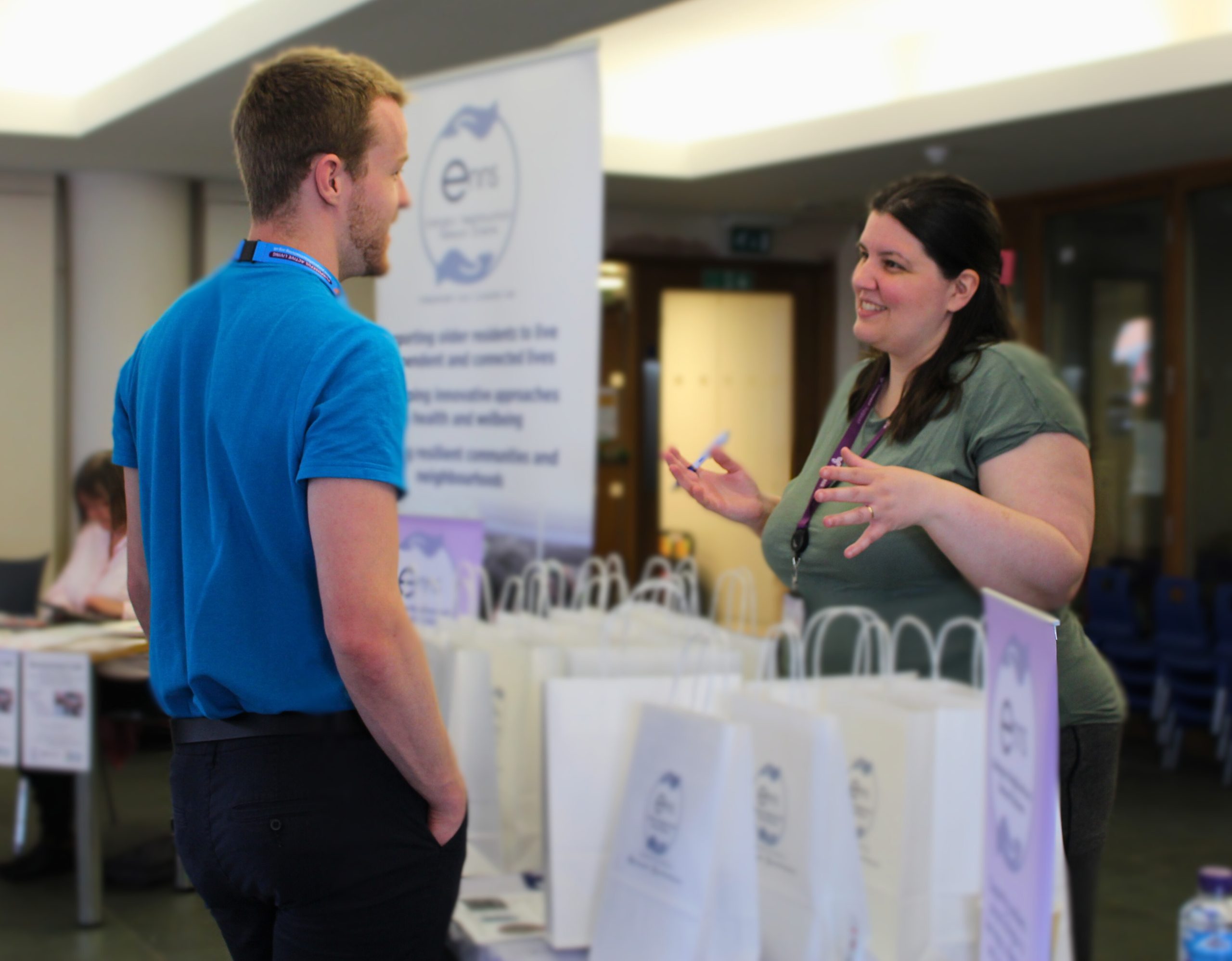 ENNS Networker Hannah in discussion with an attendee